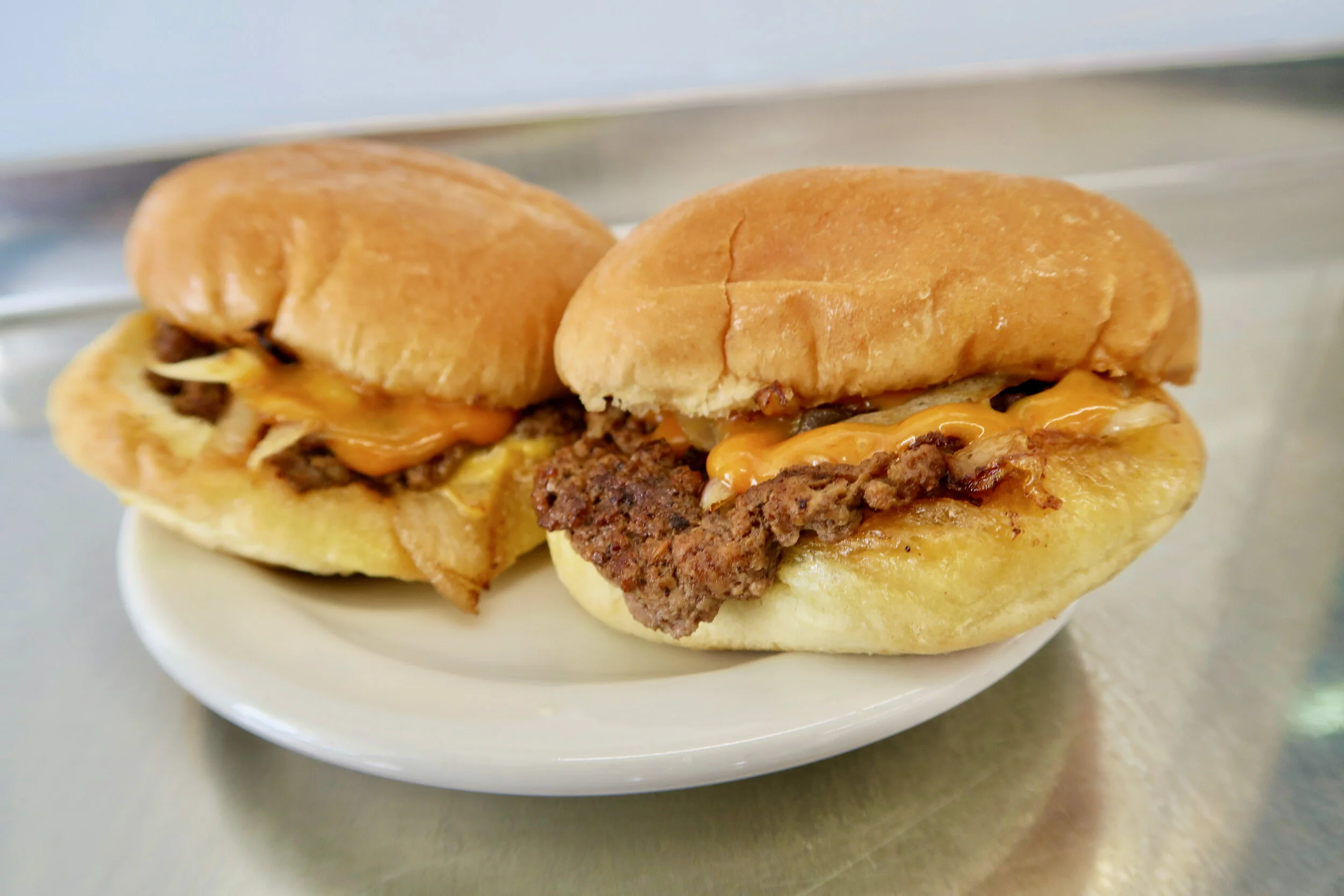 Bates' cheeseburger sliders on the griddle